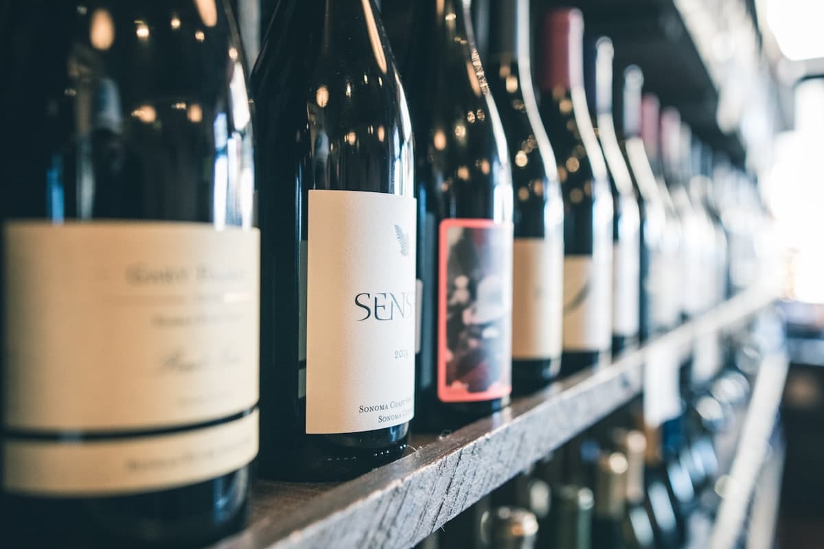 Wine bottles lined up in a wine room